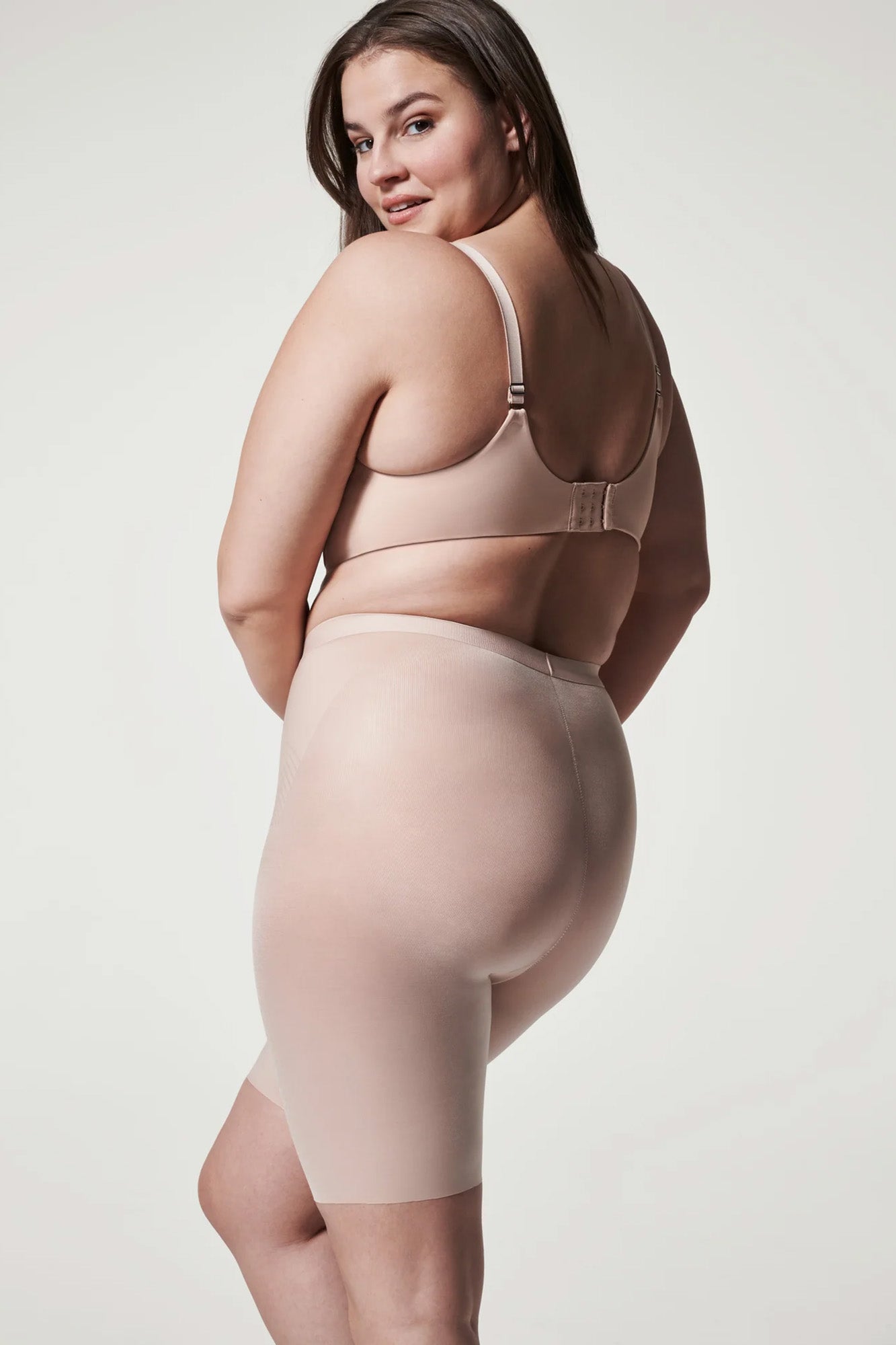 The Thinstincts 2.0 Mid Thigh Short By Spanx In Champagne Beige