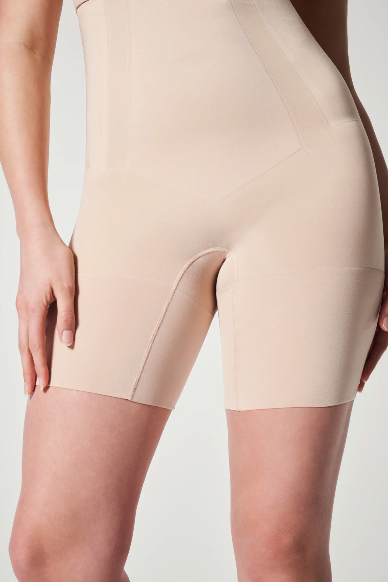 The Oncore High-Waisted Mid-Thigh Short By Spanx In Soft Nude - GINIA