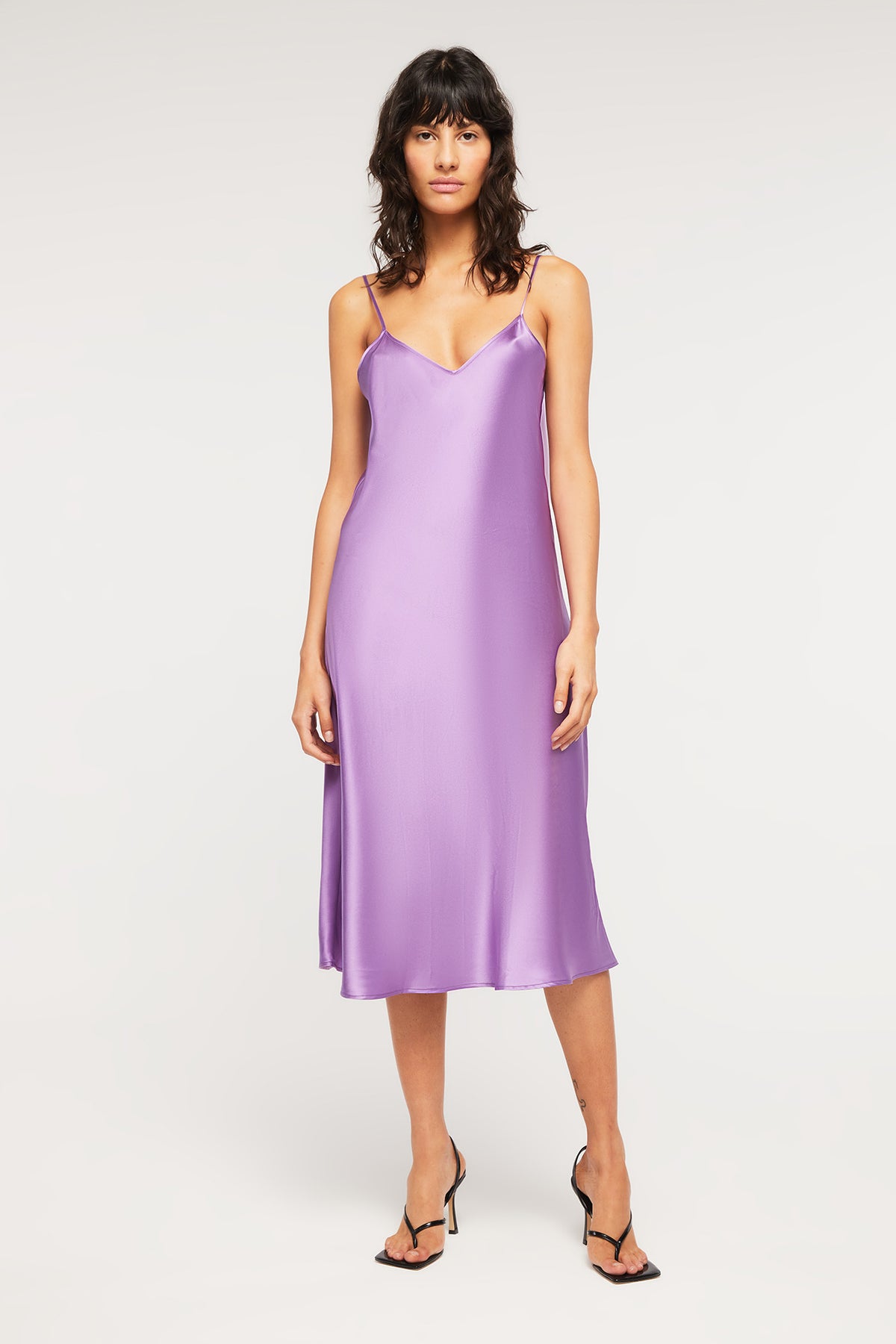 Crafted from pure silk, the Delilah Slip in Amethyst is a luxurious long slip from Ginia RTW