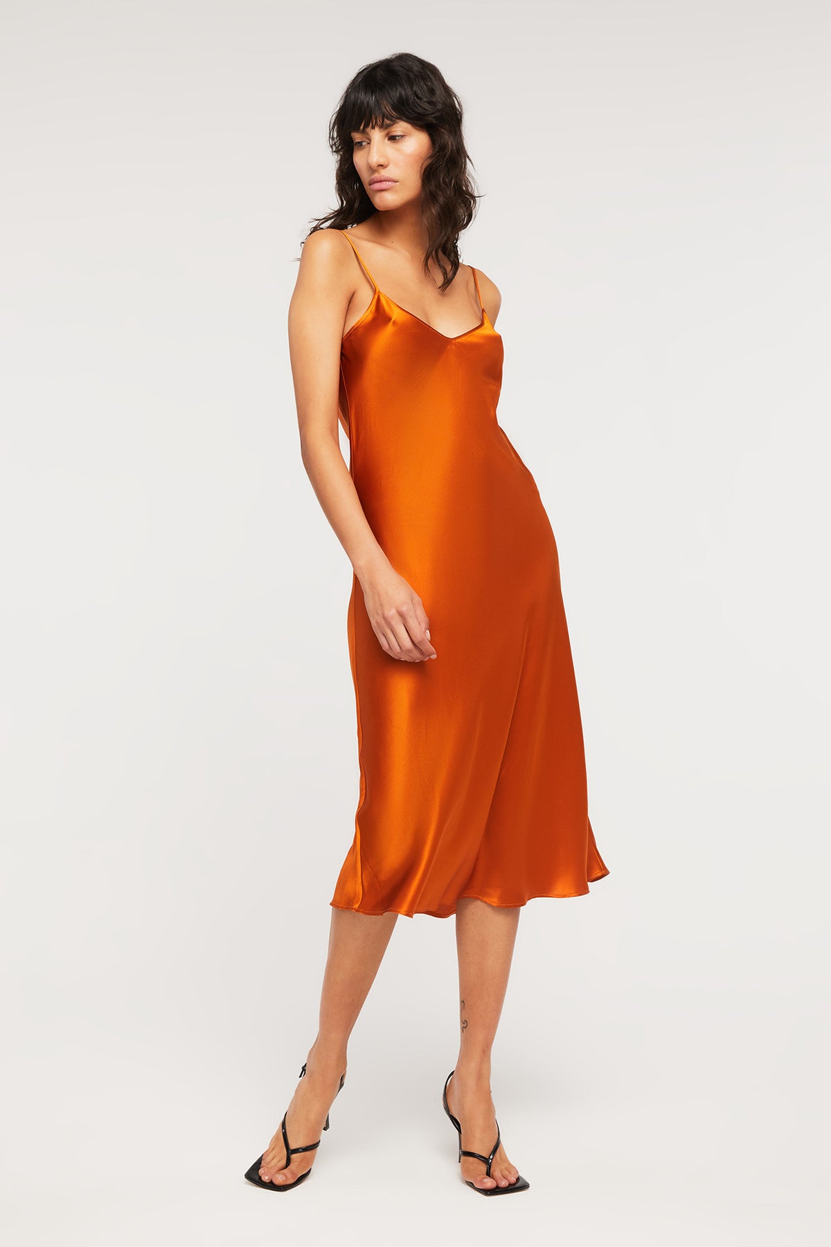 Crafted from pure silk, the Delilah Slip in Sunset is a luxurious long slip from Ginia RTW